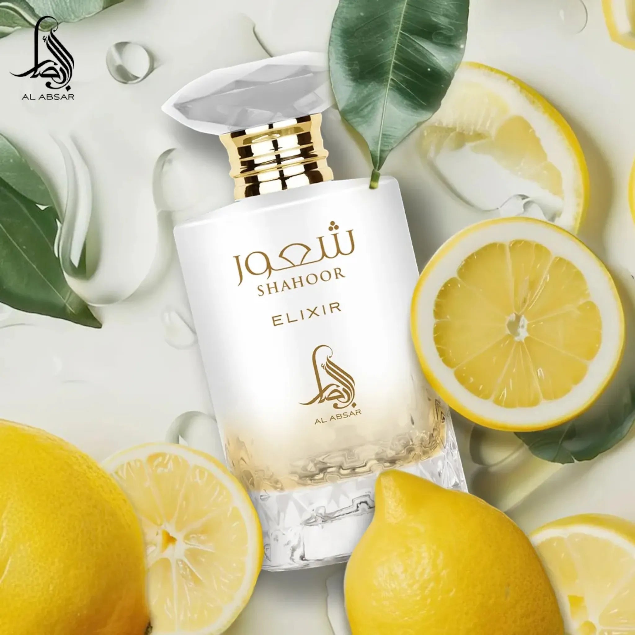 A bottle of Al Absar Shahoor elixir perfume with top notes listed as lemon, candy, and rum, middle notes as orange blossom and milk, and base notes as vanilla, benzoin, amber, and musk, presented alongside slices of lemon and a bar of soap.